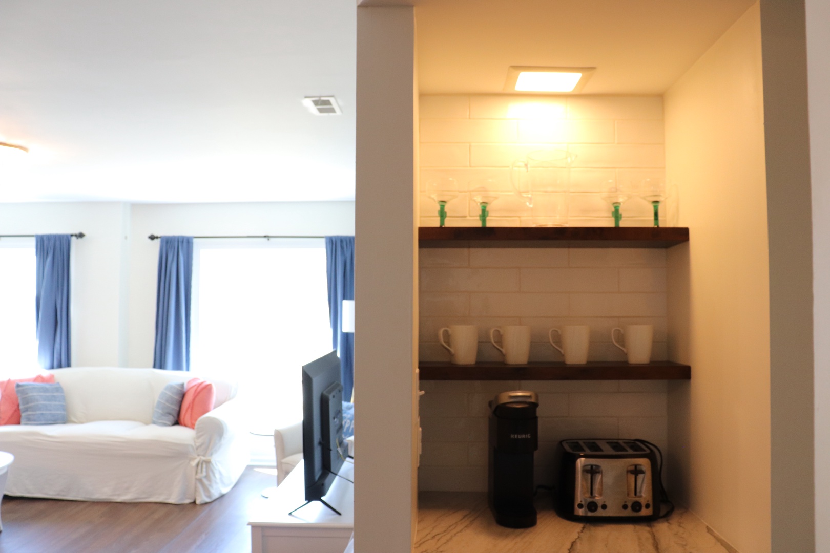 Your morning coffee station awaits with everything you need - from premium coffee maker to fresh mugs, perfectly positioned for easy access.