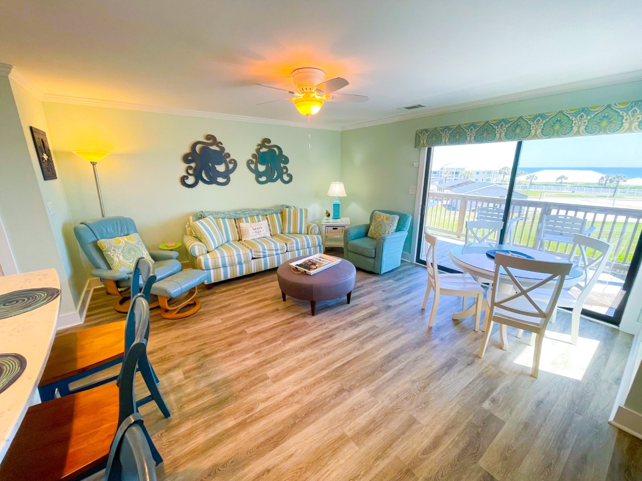 Unwind in your bright, coastal-themed living space with ocean views from your private balcony and comfortable seating for memorable beach getaways.