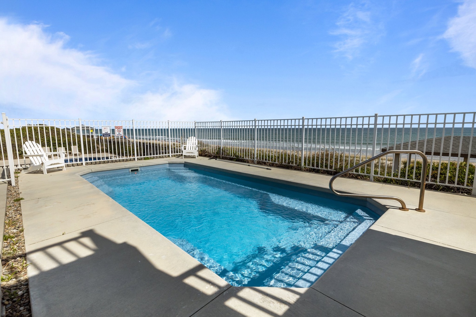 Dive into your private oasis with stunning ocean views. This sparkling pool offers the perfect blend of relaxation and coastal beauty for unforgettable moments.