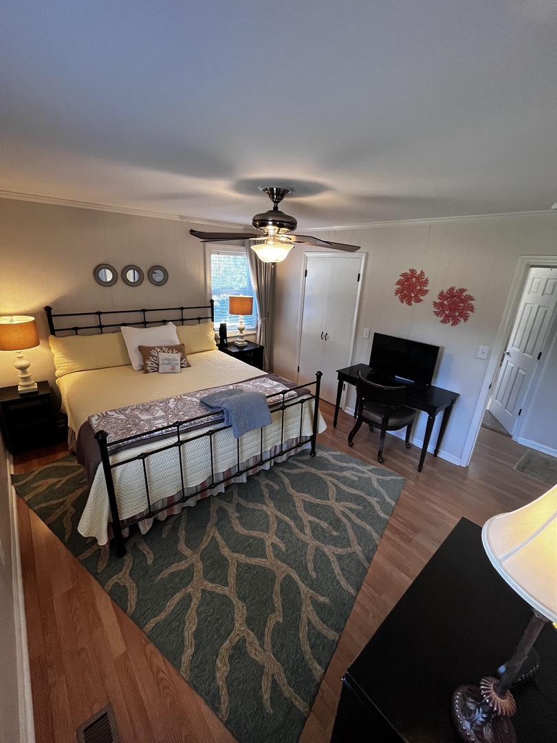 Your bright living room features a welcoming sofa, modern TV setup, and stylish décor perfect for relaxing evenings together.