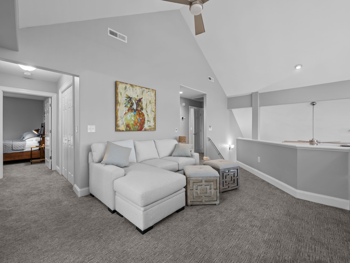 Sink into plush seating in your modern living space, where high ceilings and thoughtful design create the perfect retreat for relaxation.