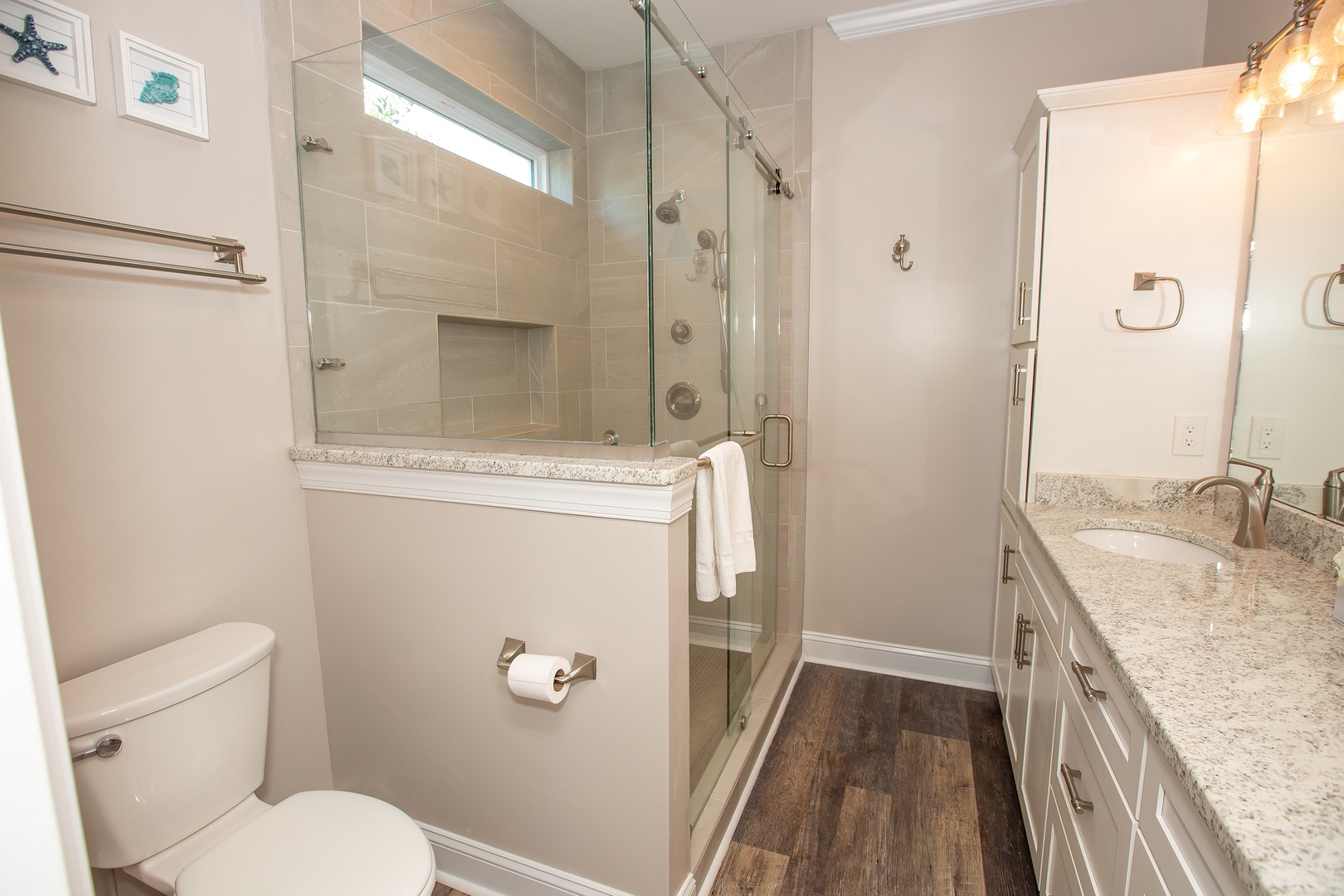 Unwind in your private spa-like bathroom featuring a luxurious glass shower, granite countertops, and elegant finishes throughout.