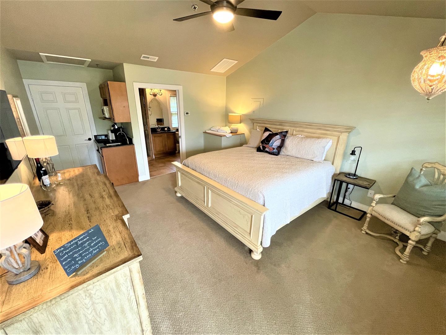 Unwind in your spacious bedroom featuring a cozy king bed, convenient workspace, and thoughtful amenities for the perfect retreat.