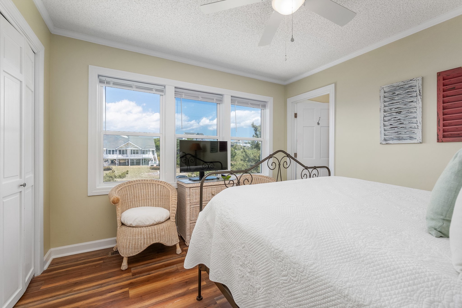 Wake up to breathtaking views from your comfortable bedroom, where coastal charm meets modern comfort for the perfect getaway.