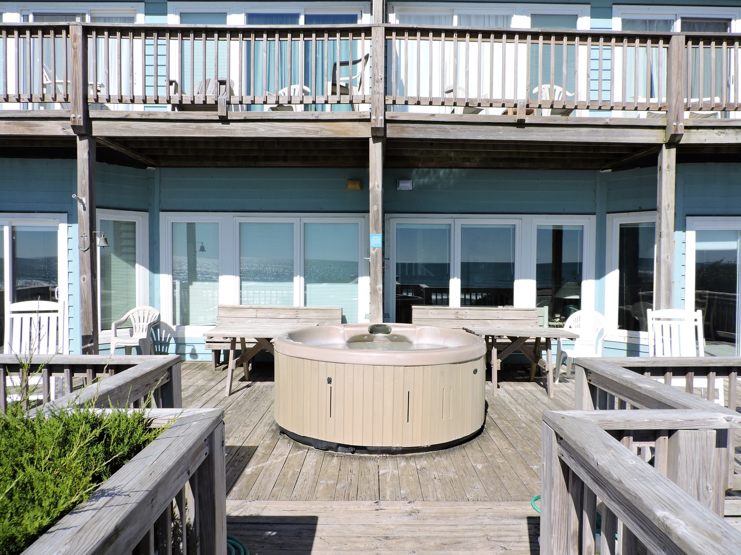 Soak in your private hot tub on the spacious deck while enjoying ocean views through floor-to-ceiling windows.