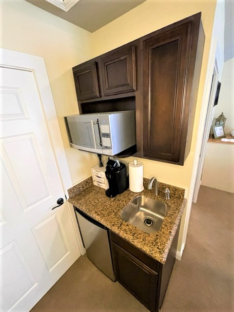 Your convenient kitchenette features granite countertops, stainless steel appliances, and a coffee maker for your morning brew.