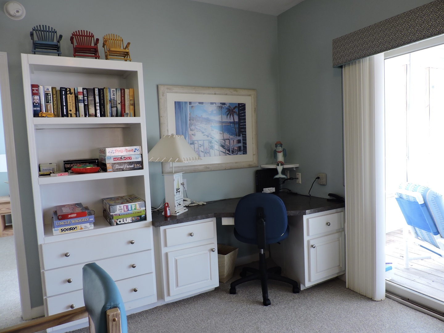 Your personal workspace awaits with built-in storage, books, and games, plus a peaceful balcony view for inspiring breaks.