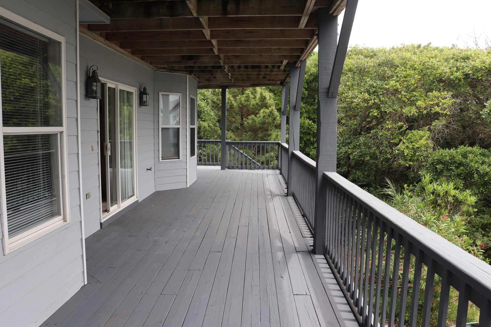 Step onto your private wraparound deck and breathe in the fresh air while taking in peaceful views of lush greenery.