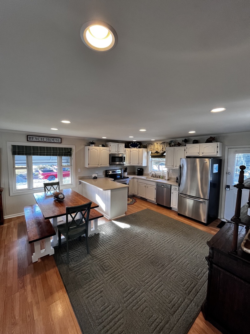 Your modern kitchen flows seamlessly into the cozy living area, where you can cook, dine, and relax in style.