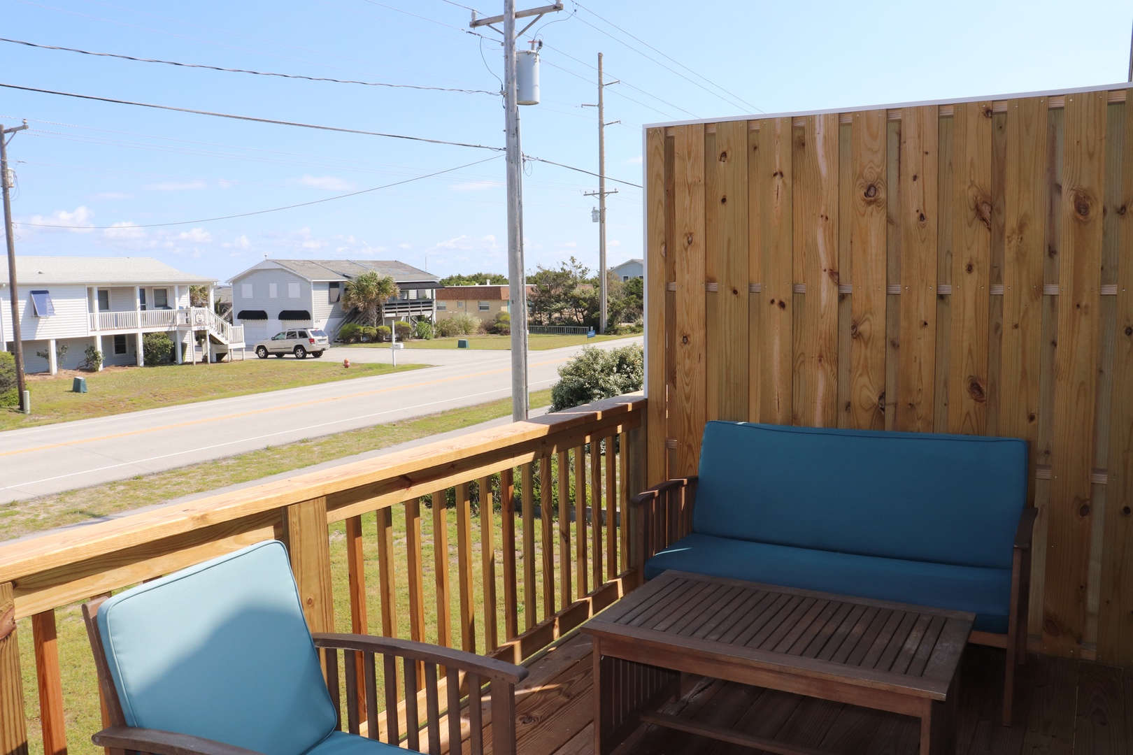 Relax on your private deck with comfortable seating overlooking the peaceful neighborhood.