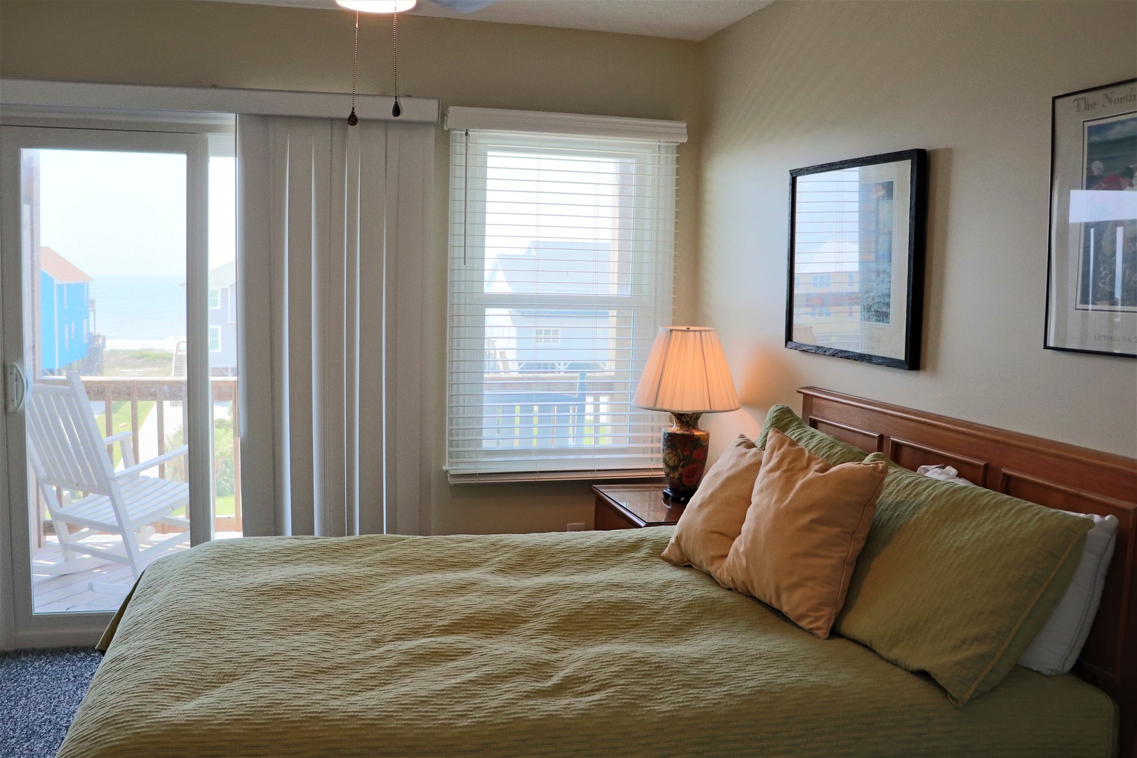 Wake up to ocean breezes in this serene bedroom, where soft linens and warm lighting create your perfect coastal retreat.