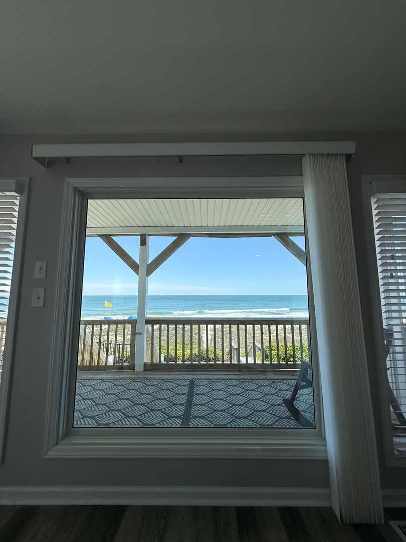 Step through your private door to a charming balcony where ocean breezes and serene sea views greet you—perfect for morning coffee or sunset relaxation.