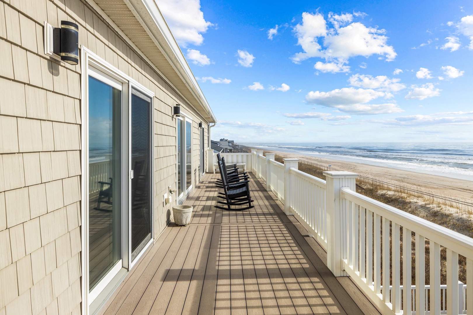 Your private oceanfront deck invites you to unwind with morning coffee as gentle waves kiss the shore below.