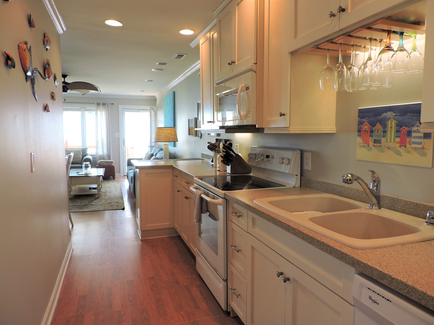 Your fully equipped galley kitchen features everything needed for memorable meals, from granite counters to wine glass storage.