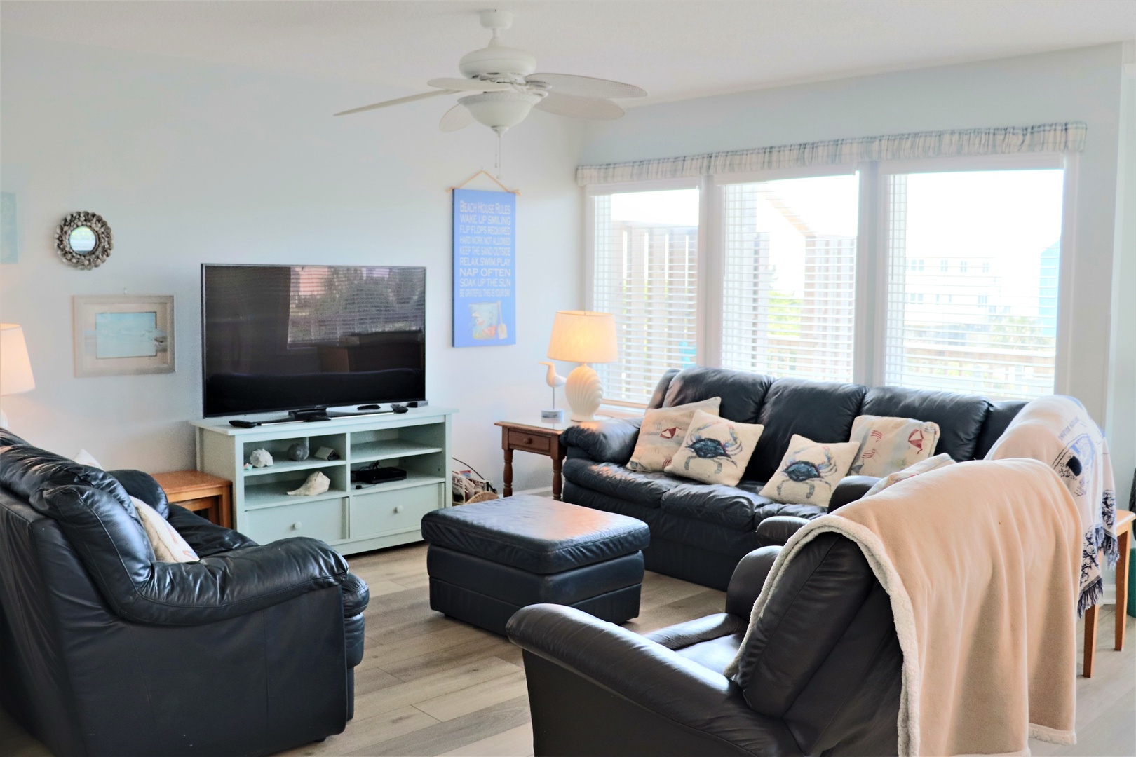 Sink into plush leather seating while your favorite shows play on the large TV, with natural light streaming through bright windows.