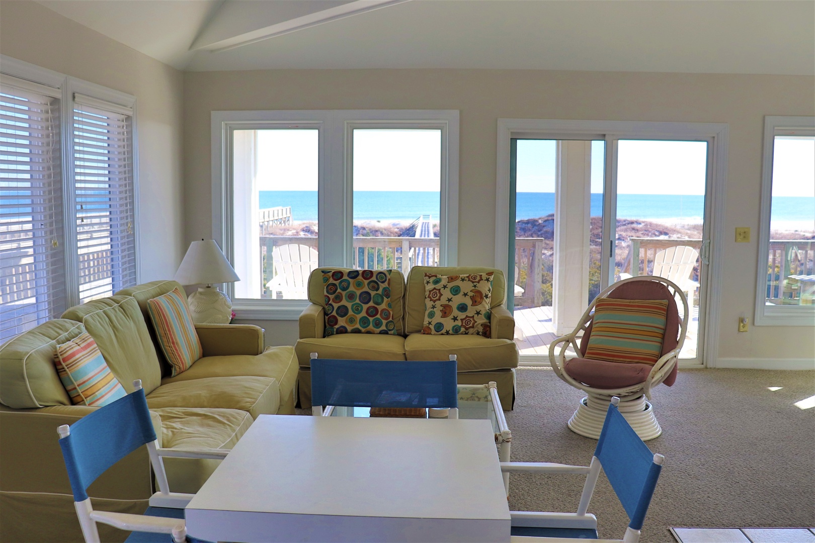 Relax in your bright living room with stunning ocean views, comfortable seating, and coastal charm that invites you to unwind by the sea.