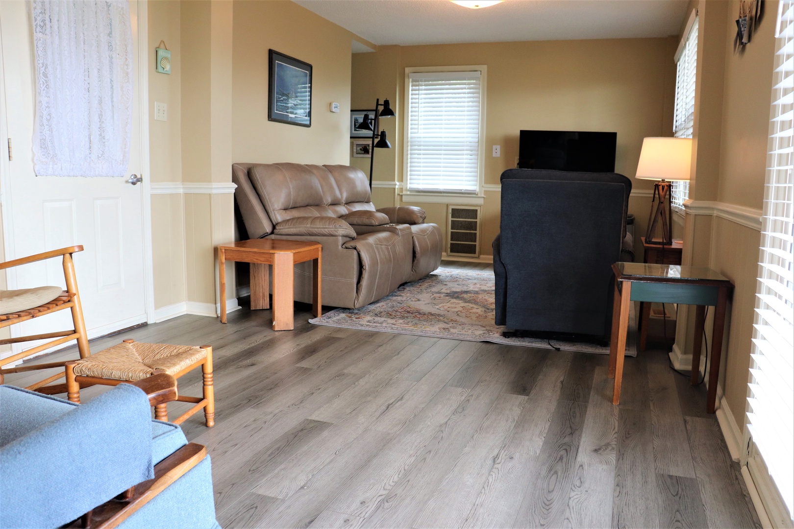 Settle into your cozy living space with plush leather seating and warm lighting for perfect evening relaxation.