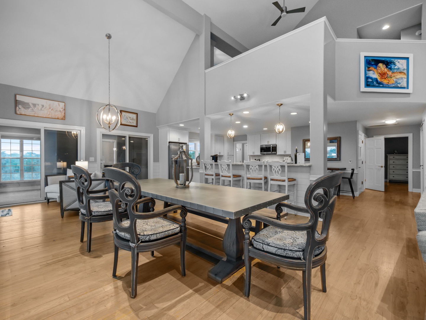 Gather around your elegant dining table for memorable meals while enjoying the soaring cathedral ceilings and flowing open layout.