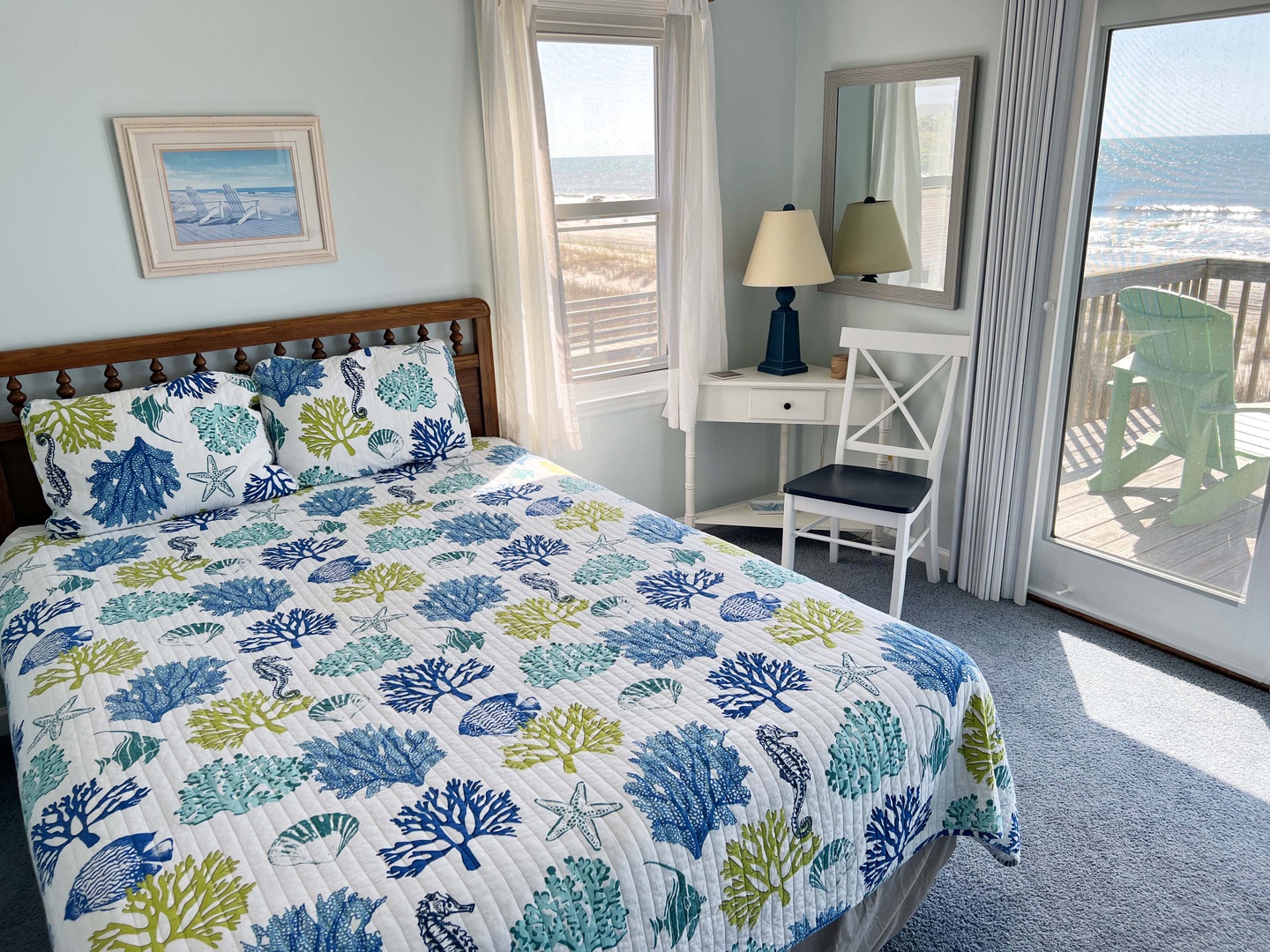 Wake up to breathtaking ocean views from your coastal bedroom. The sea-themed bedding and private balcony create your perfect seaside retreat.