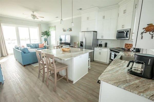 Your bright, open kitchen flows seamlessly into the living space, perfect for cooking meals while enjoying time with loved ones.