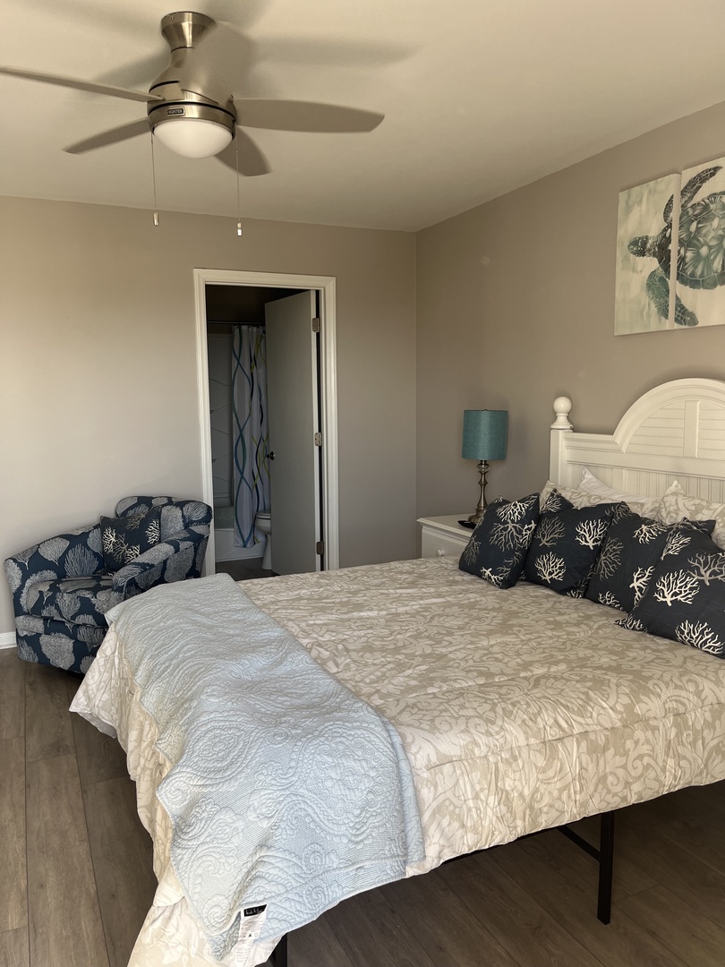 Rest peacefully in your elegantly appointed bedroom featuring crisp linens, coastal-inspired décor, and thoughtful nautical touches that create a serene seaside retreat.