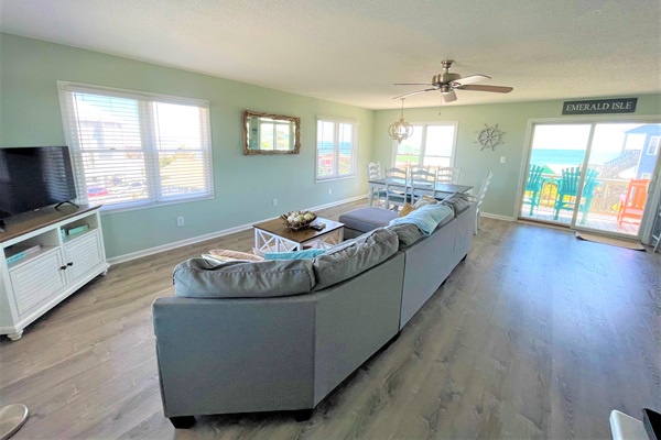 Sink into plush seating while ocean breezes flow through your bright, coastal-themed living space with stunning water views from your private balcony.