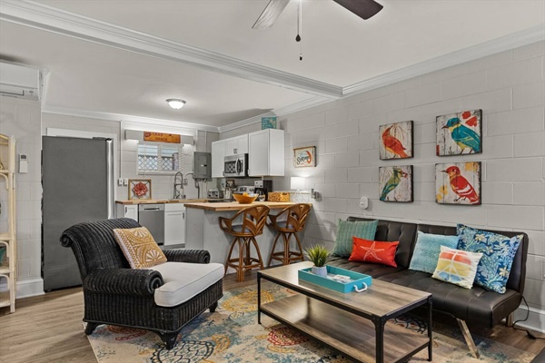 Relax in your stylish open-concept space where colorful artwork and cozy furnishings create the perfect home base for your getaway.