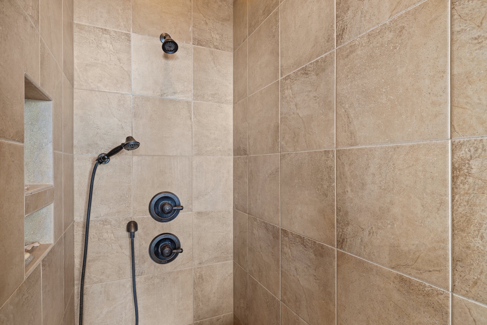 Step into your luxurious shower featuring dual controls and rainfall showerhead for the perfect temperature every time.