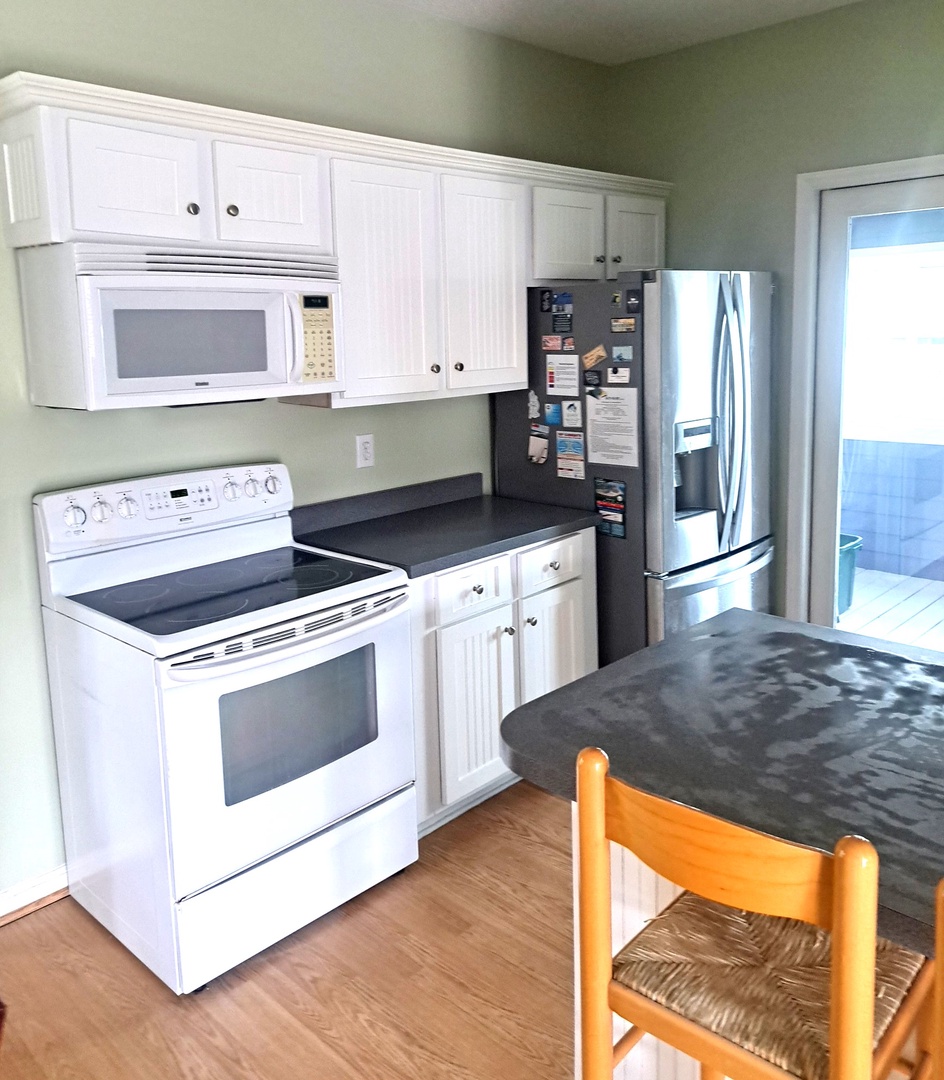 Your fully equipped kitchen features modern appliances and plenty of storage for preparing memorable meals during your stay.