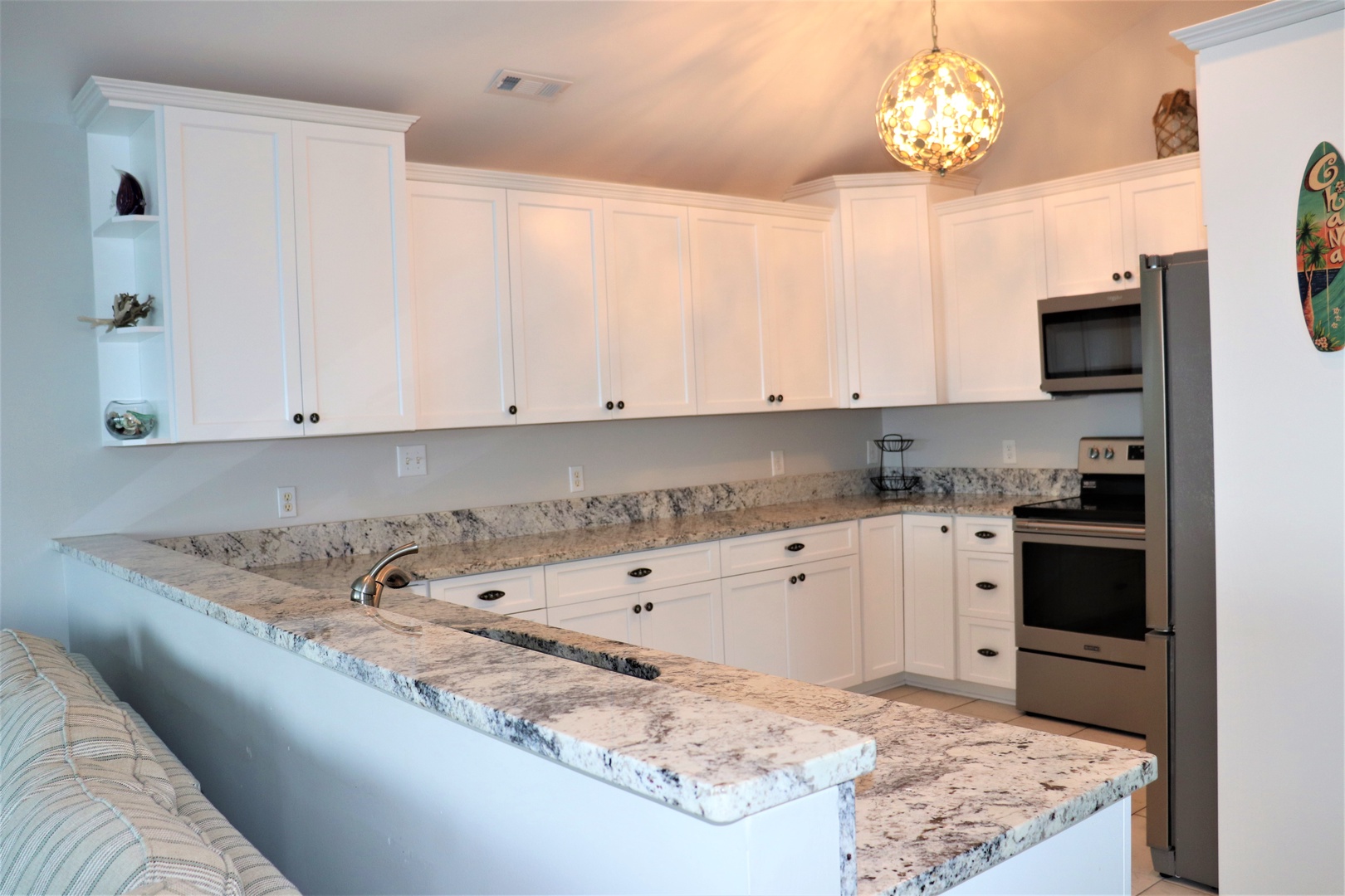 Your spacious kitchen features granite countertops, modern appliances, and ample cabinet space for all your culinary adventures.