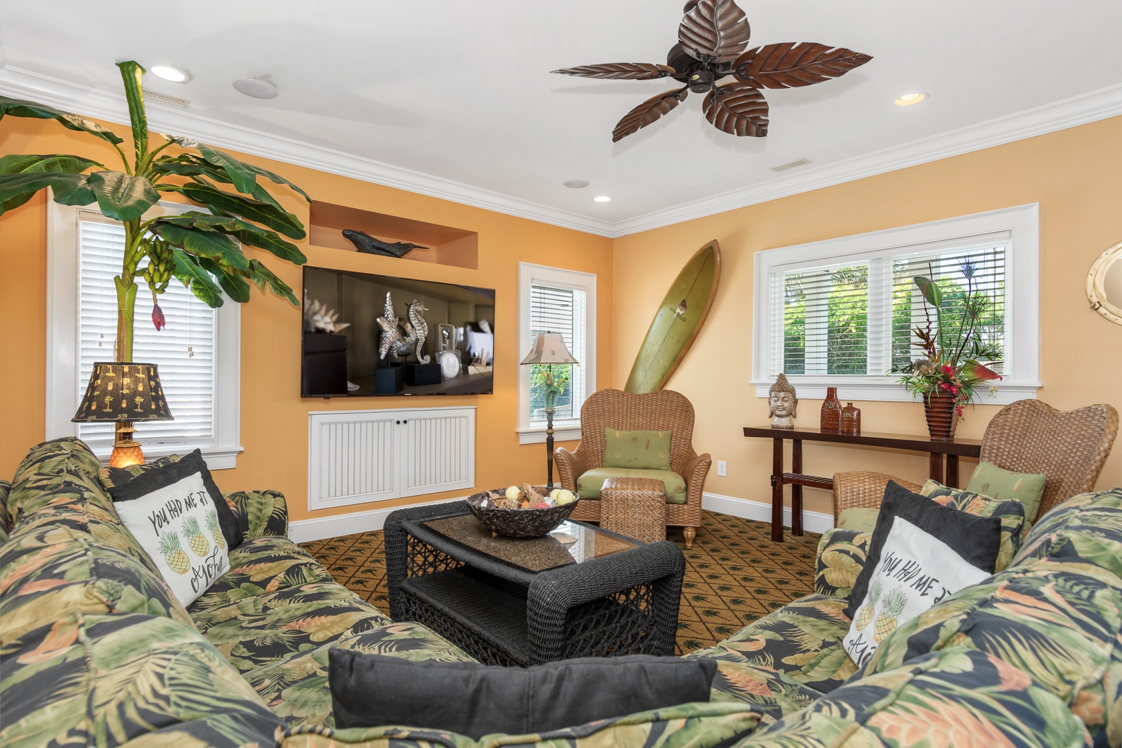 Unwind in your tropical-themed living room with cozy seating, flat-screen TV, and island-inspired décor that makes you feel like you're on vacation.