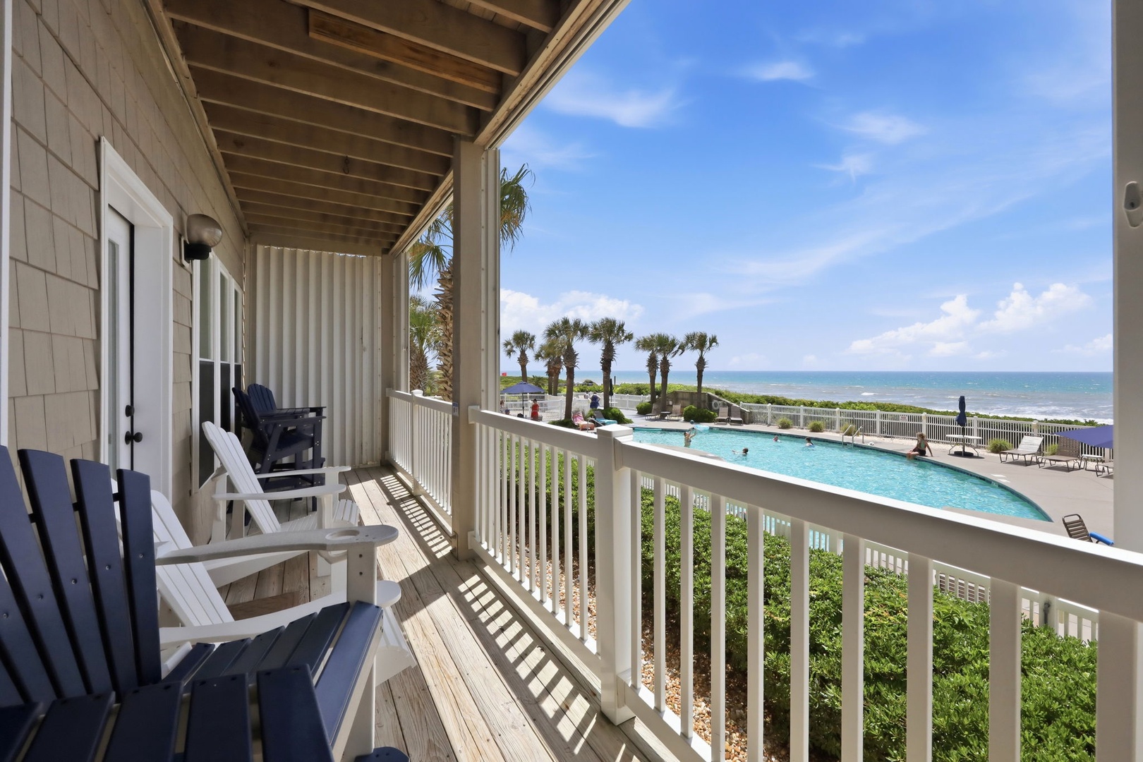 Relax in your private patio chairs and soak in serene ocean views, with the sparkling pool and beach just steps away from your coastal retreat.