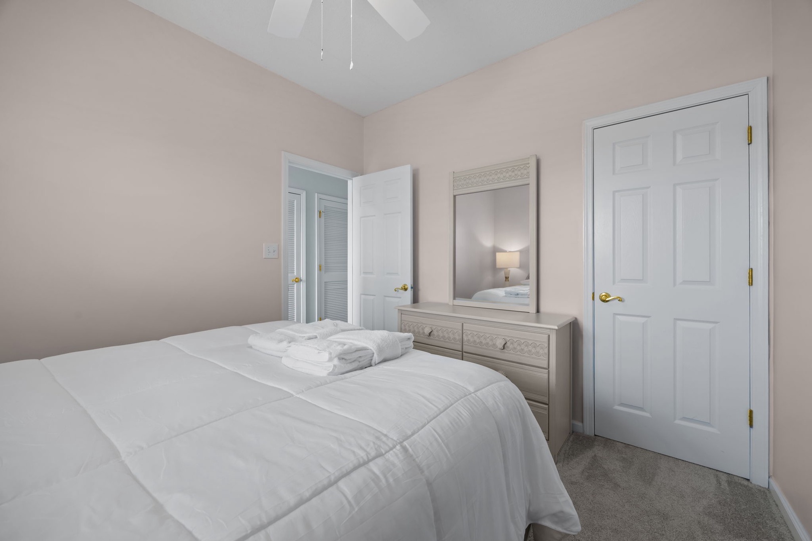 Sink into soft linens and wake refreshed in your peaceful bedroom, complete with plush towels and serene decor.