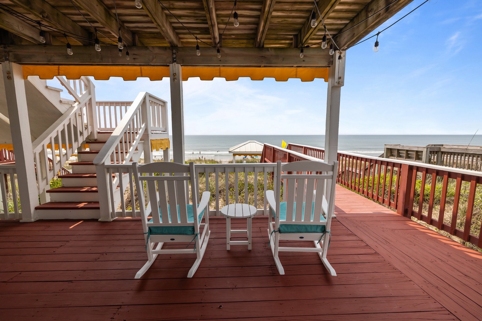 Unwind in your rocking chairs on this spacious deck, where ocean breezes and stunning sea views create the perfect spot for morning coffee or evening relaxation.