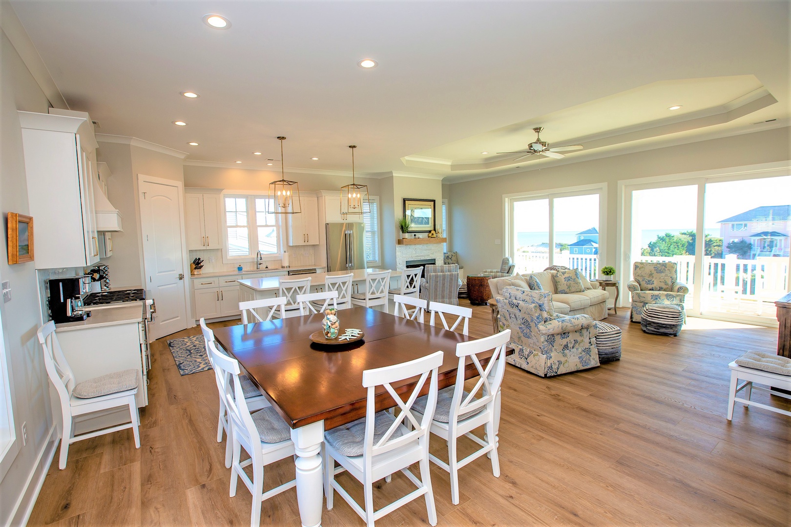 Step into your bright, open-concept haven where coastal charm meets modern comfort. You'll love gathering around the spacious dining table.