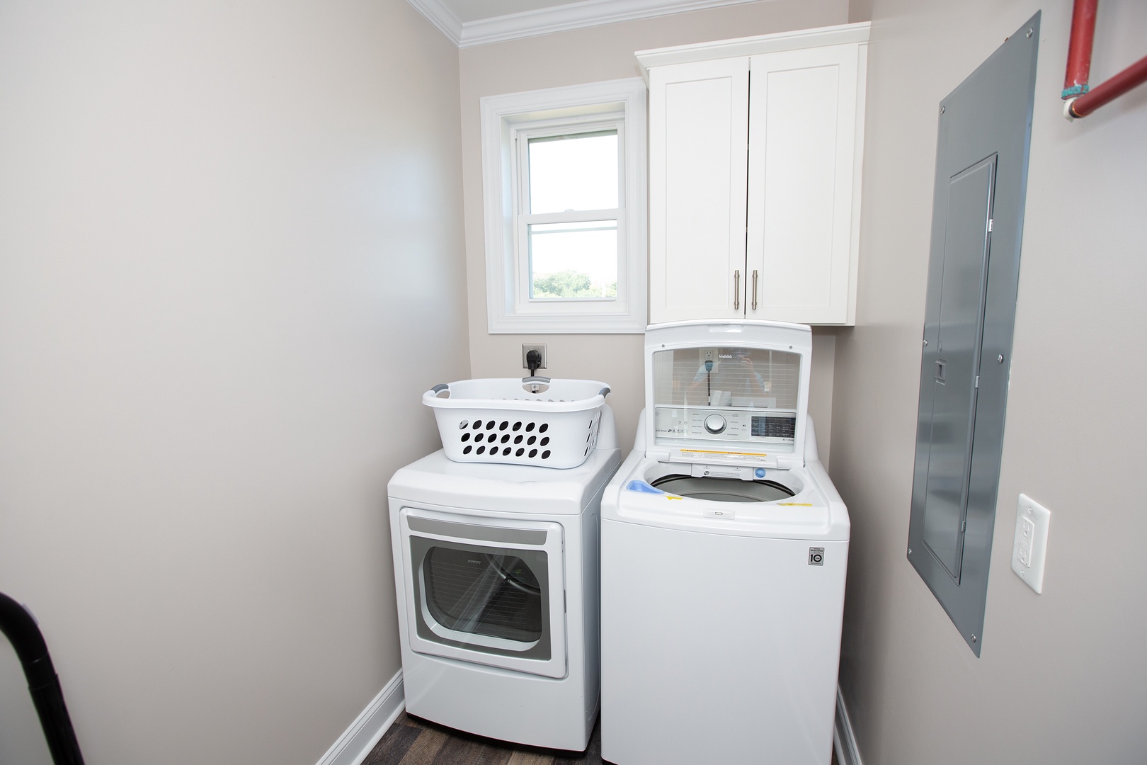 Your dedicated laundry space keeps travel light—full-size washer and dryer with storage above handle all your vacation needs effortlessly.