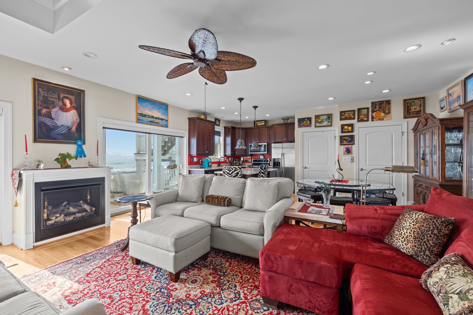 Your cozy living space features a crackling fireplace, ocean views, and comfortable seating where you'll unwind after beach days.