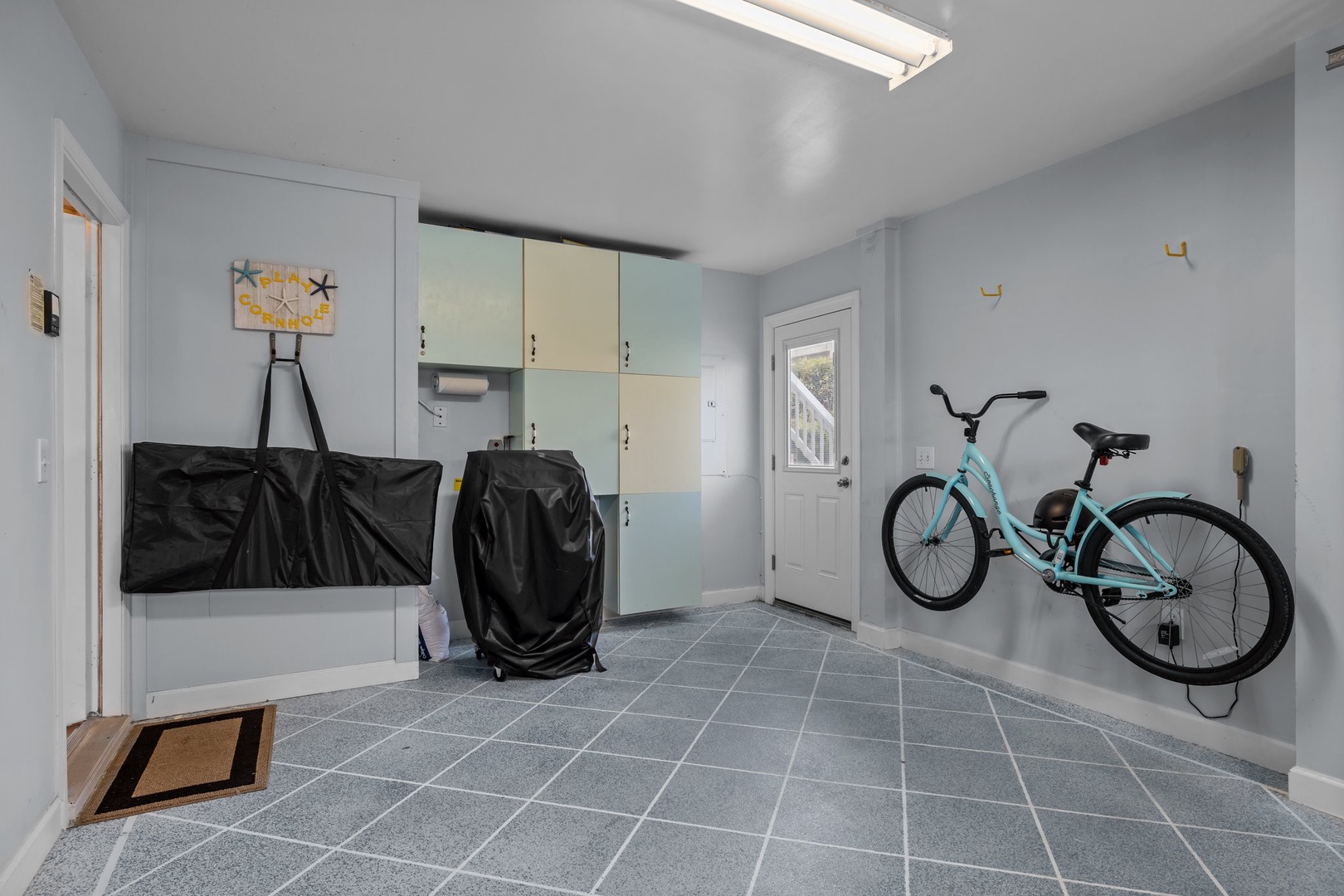 Your adventure gear finds a perfect home in this spacious mudroom with bike storage and organized lockers.