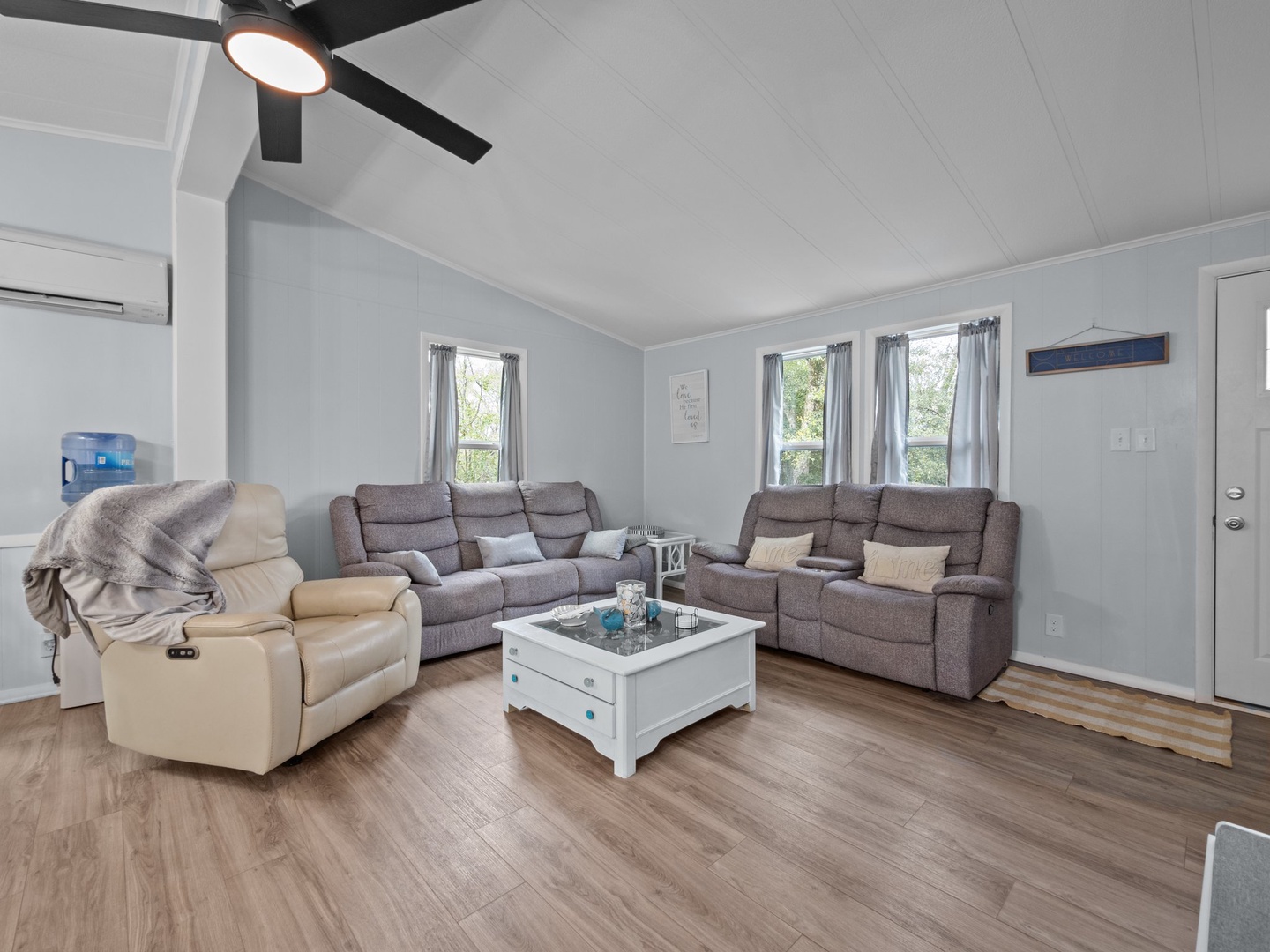 Settle into this spacious living room with plush recliners and sofas where you can unwind after your adventures.