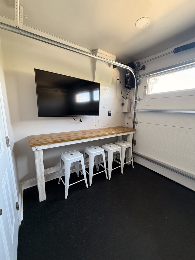 Your modern kitchen awaits with sleek countertops, stylish white cabinetry, and an induction cooktop perfect for whipping up meals during your stay.