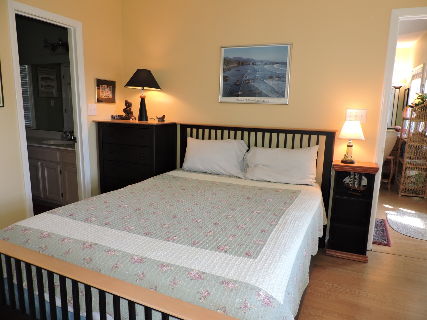 Your peaceful bedroom retreat awaits with a comfortable bed, warm lighting, and tasteful decor to help you unwind after exploring.