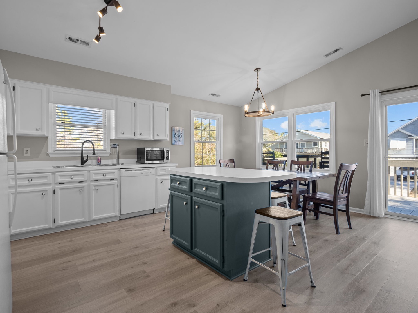Your open kitchen and dining space features modern appliances, a stylish island for meal prep, and bright windows that fill the room with natural light.