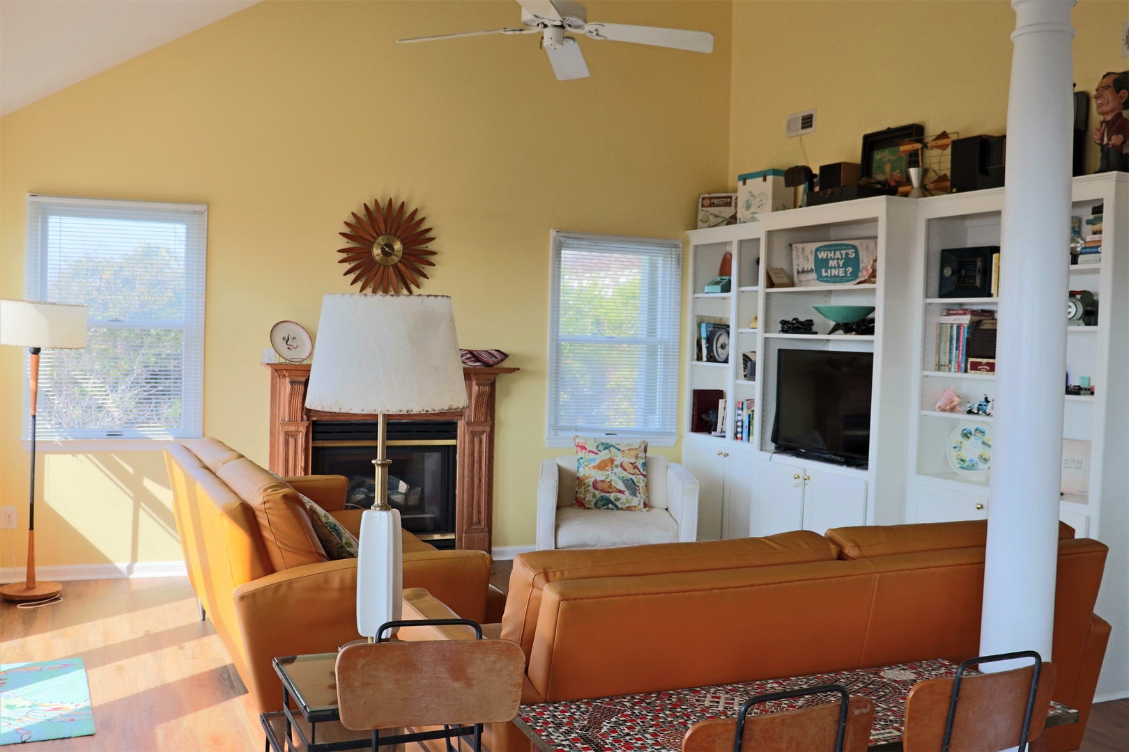 Unwind in your spacious living area with leather seating, cozy fireplace, and entertainment center—perfect for relaxing after exploring.