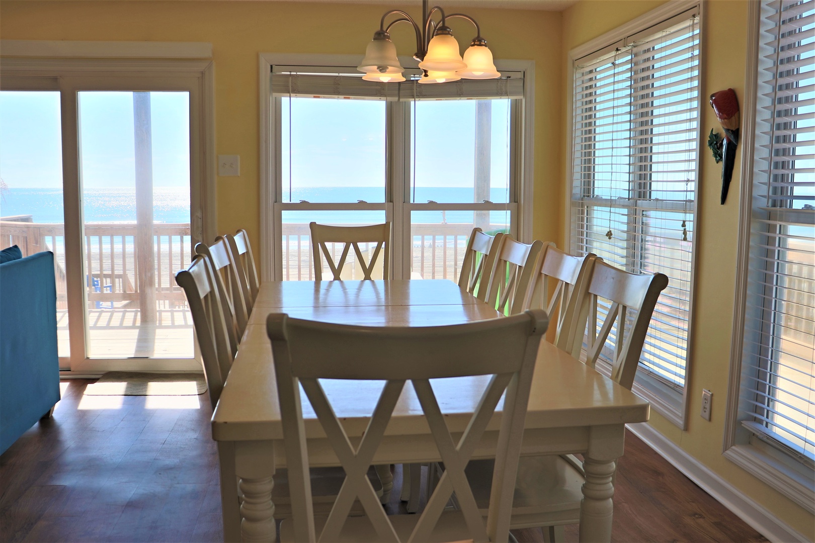 Gather around your spacious dining table where ocean views frame every meal through sliding doors to your private deck.