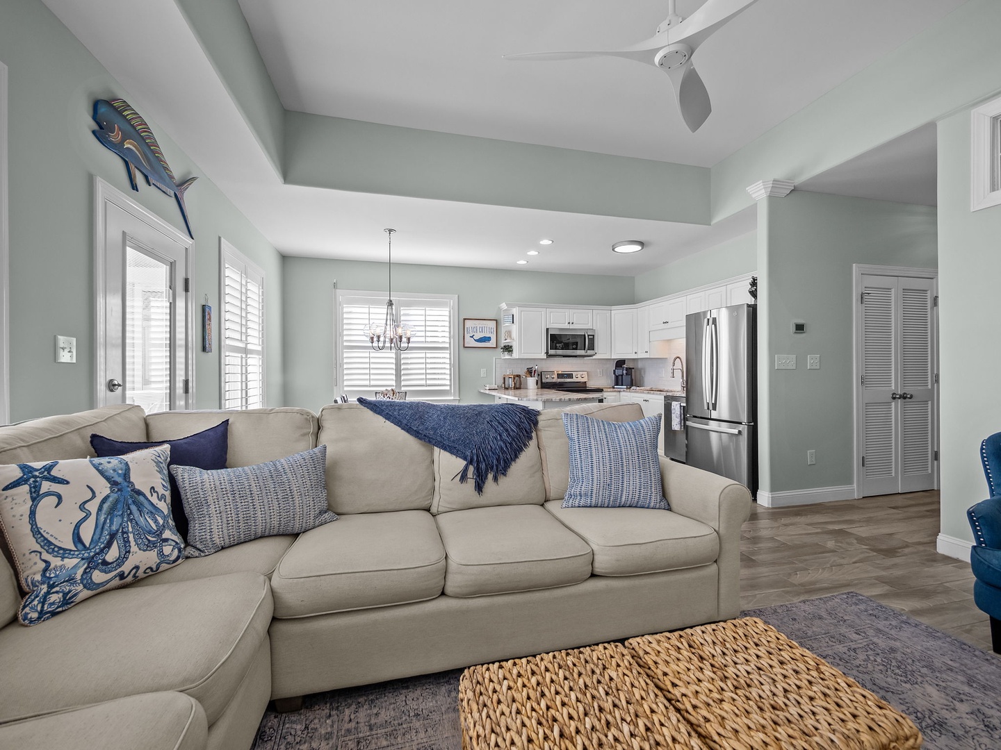 Sink into this coastal-inspired sectional sofa with nautical accents while enjoying the open-concept layout that flows into your fully equipped kitchen.