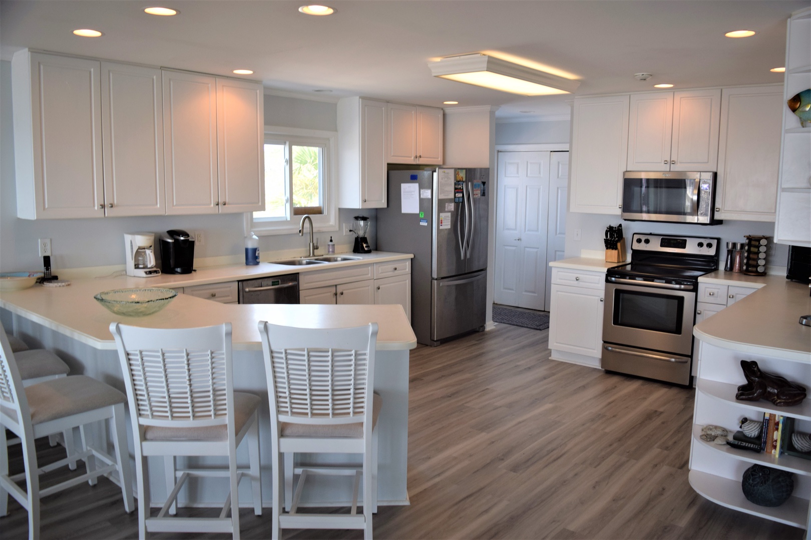 Your bright, modern kitchen welcomes you with granite countertops, stainless steel appliances, and a spacious island perfect for morning coffee or meal prep.
