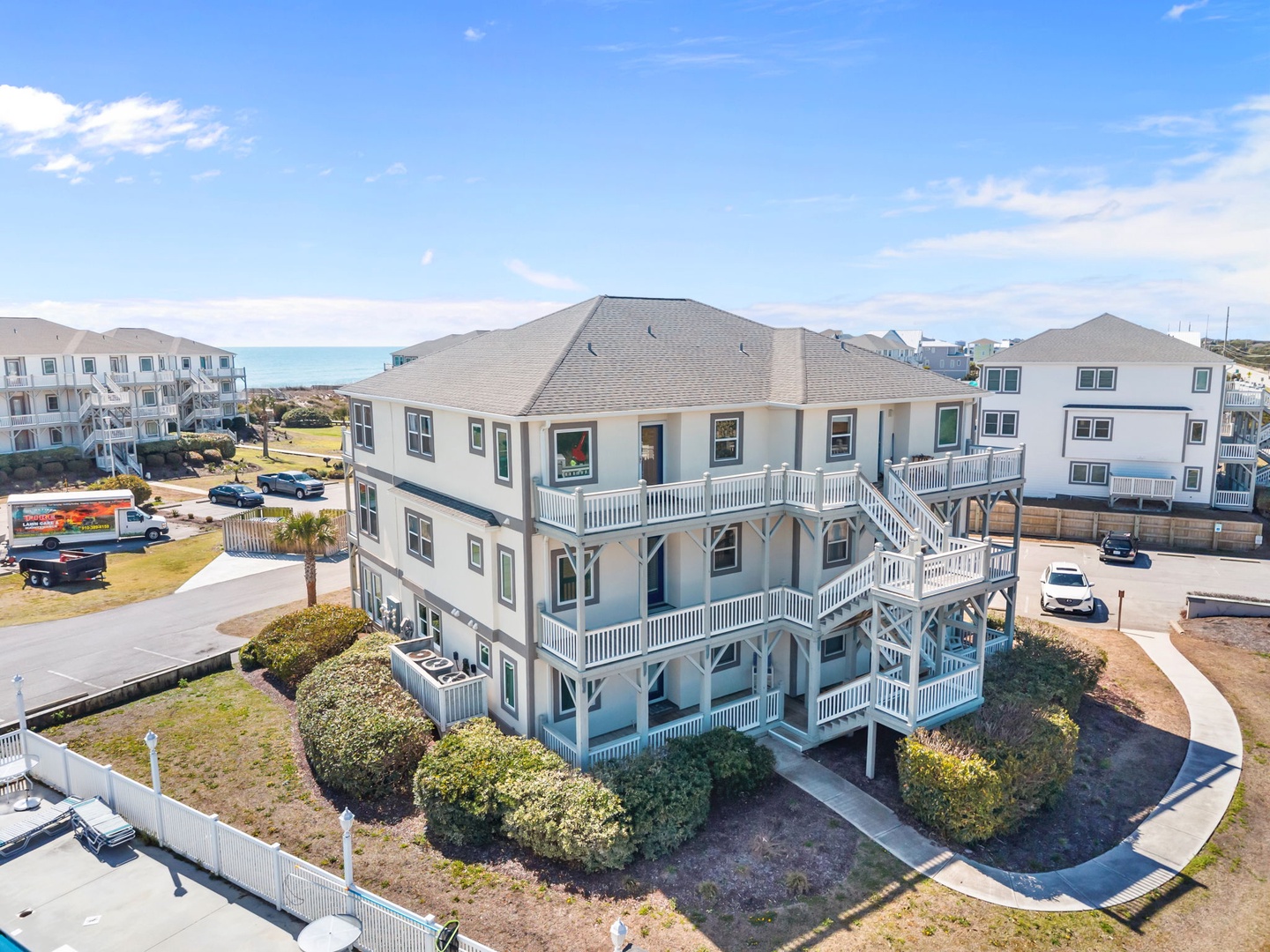 Coastal vacation rental featuring elevated decks and beach access in a charming seaside neighborhood.