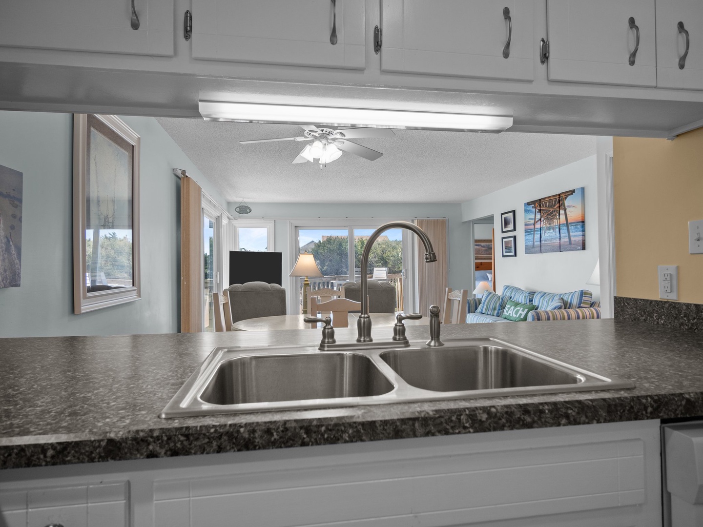 Cook with ease in your fully equipped kitchen while enjoying views of the living area and beyond through the open layout.