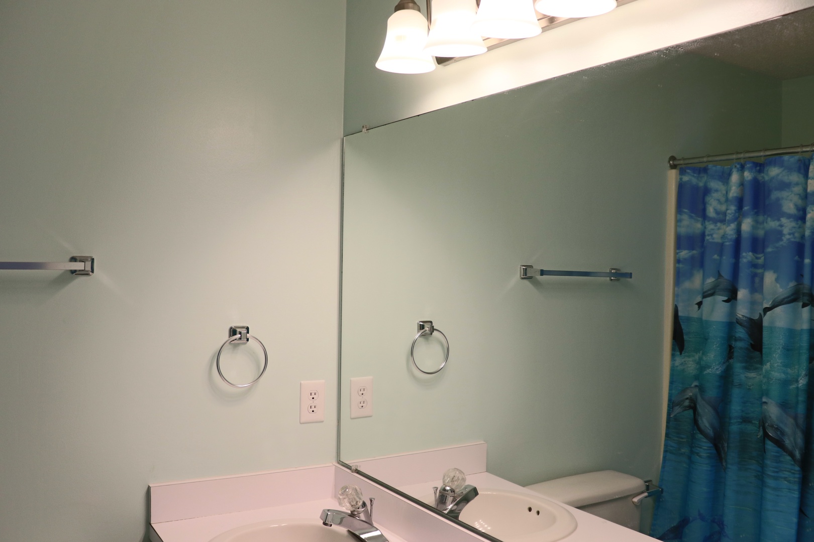 Freshen up in your spacious bathroom with ample lighting, storage, and a relaxing shower area.