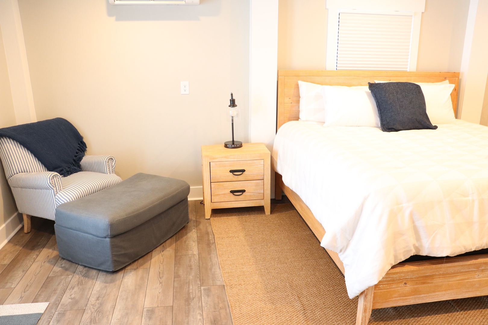 Sink into crisp white linens and unwind in your cozy armchair after a day of adventure.